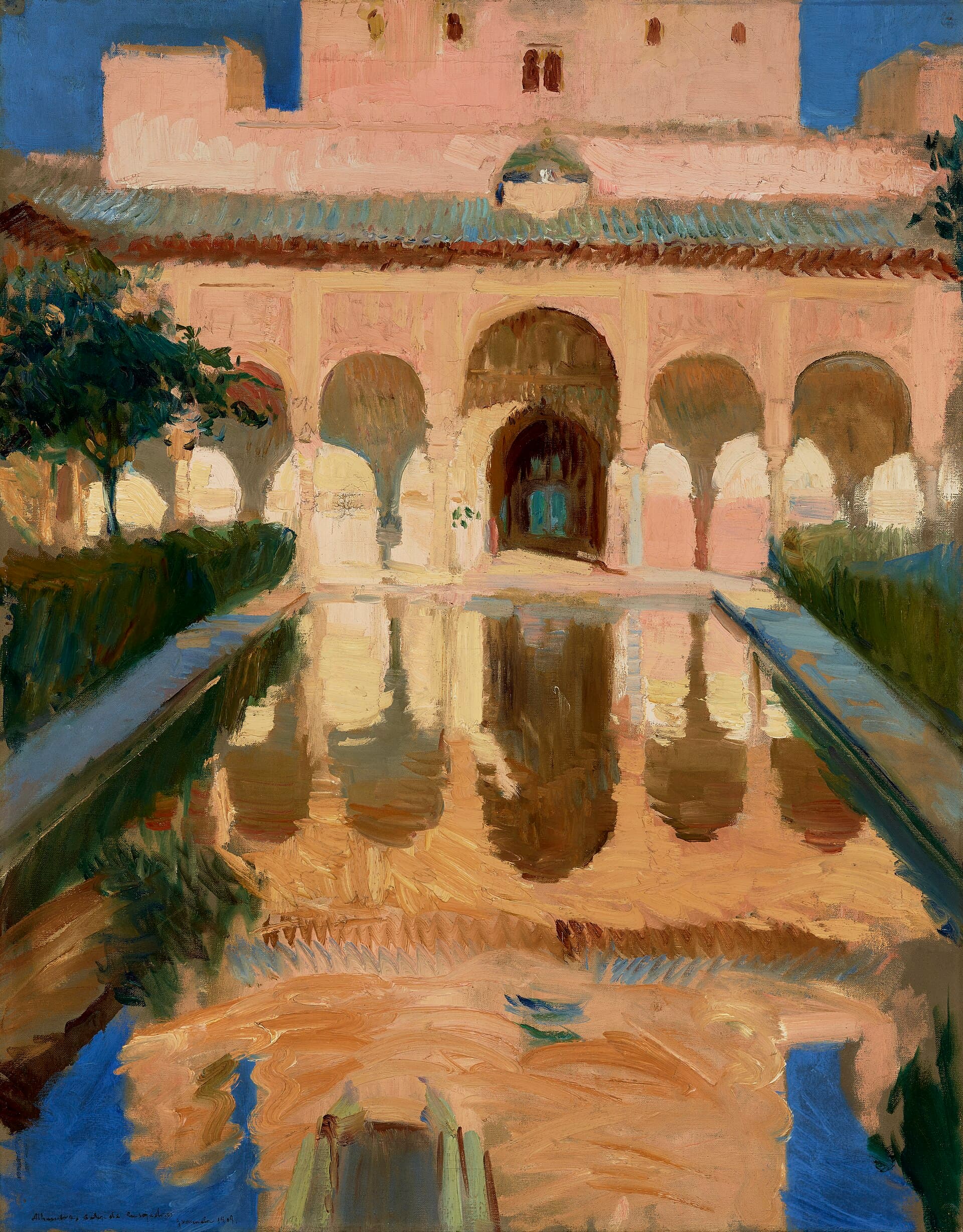 Ornate golden Alhambra arcade reflected in a still courtyard pool
